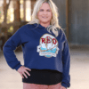 Woman Wearing Cropped Hoodie with Red Owl Logo in Navy